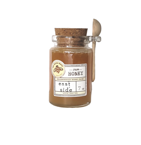 honey in a jar with wooden spoon